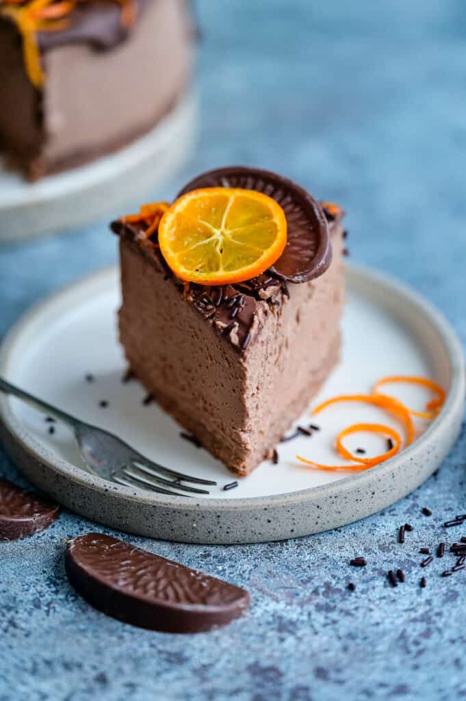 Slice of chocolate orange cheesecake on a plate