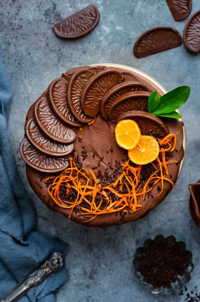 Chocolate Orange Cheesecake decorated with orange zest strips and Terry's Chocolate Orange segments