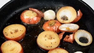 pan frying onions in skillet