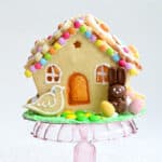 Easter gingerbread house decorated with candy and cookies