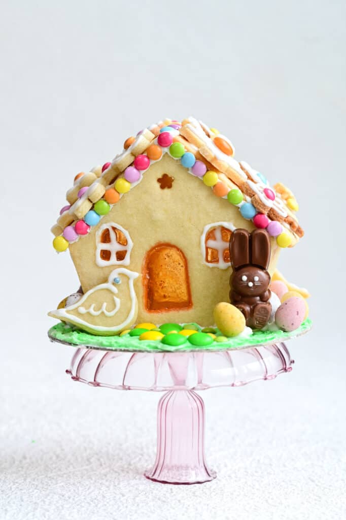 Easter gingerbread house decorated with candy and cookies