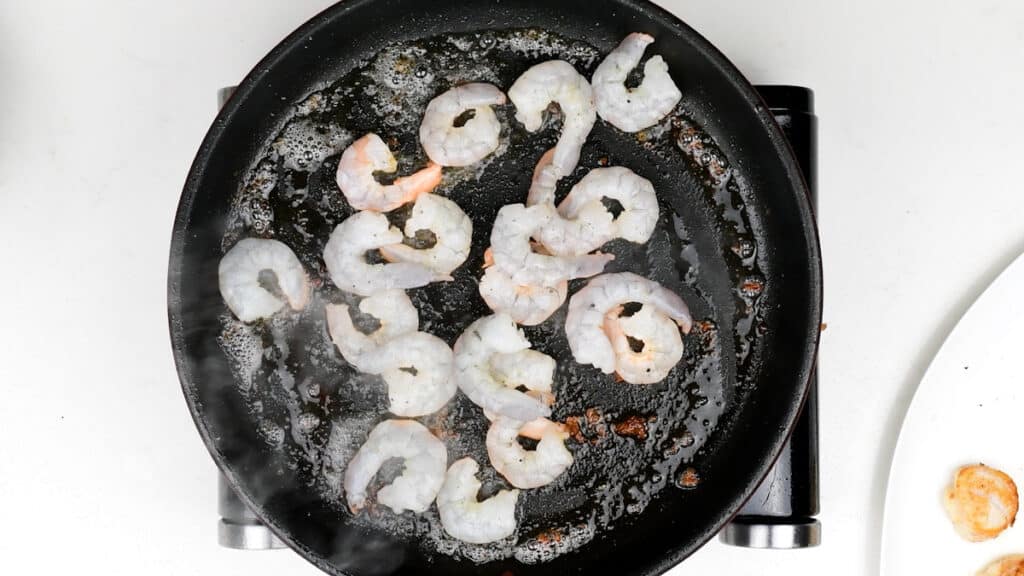 Pan frying shrimp in a skillet
