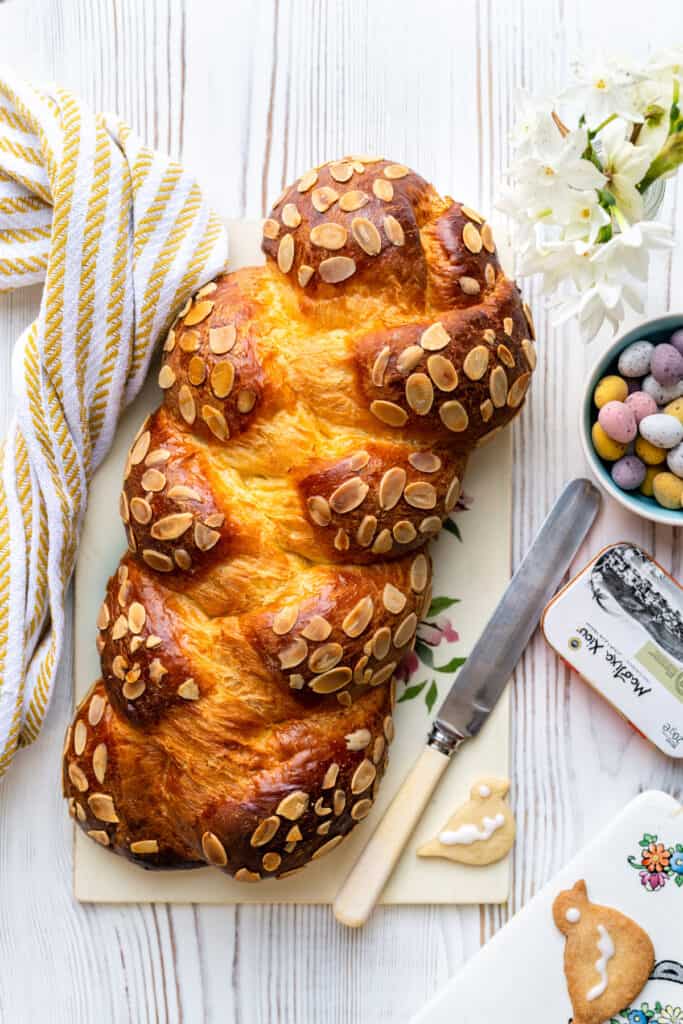 Greek Tsoureki three strand braided Easter bread topped with flaked almonds