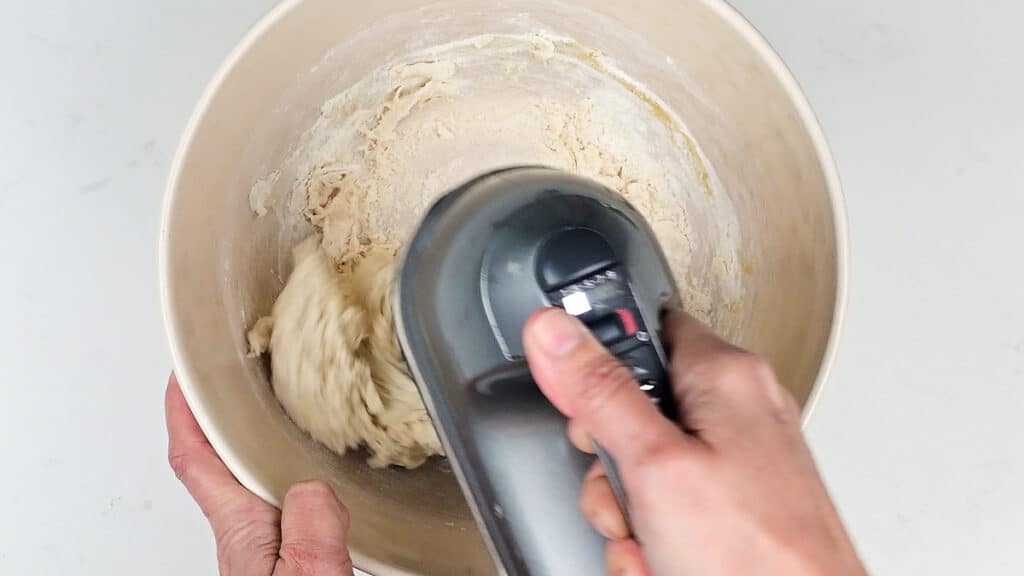 mixing dough with an electric hand mixer