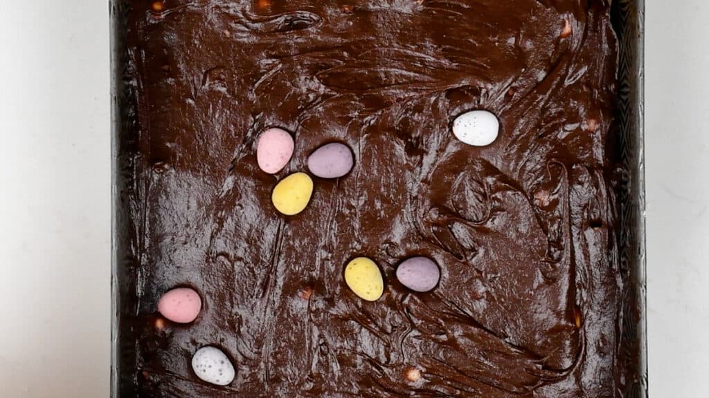 Topping brownies with mini chocolate eggs