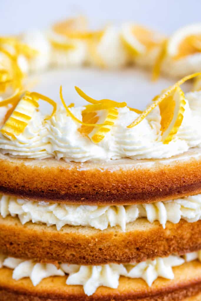 Close up on a lemon birthday cake with lemon frosting