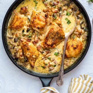 Mary Berry's Chicken CasseroleMary Berry's Chicken Casserole with herbs, bacon, mushrooms and cream in a pan
