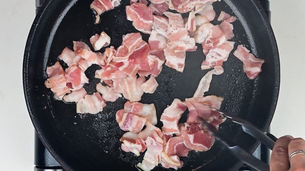 pan frying diced streaky bacon