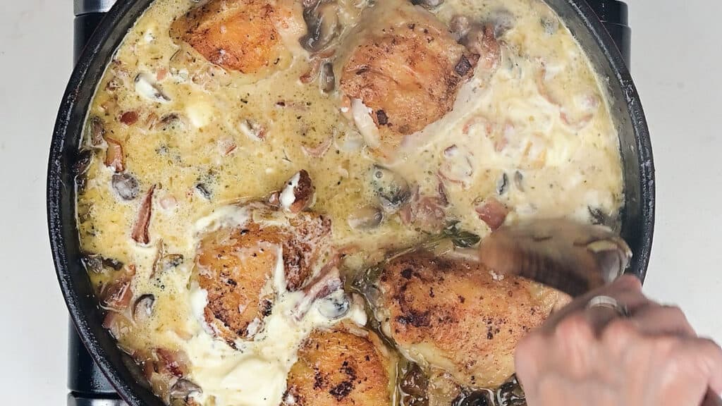 stirring creme fraiche into chicken casserole