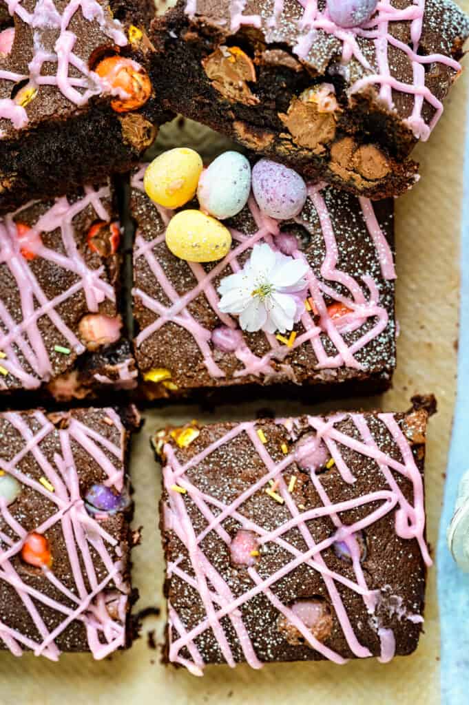 Mini Egg Brownies sliced into squares with pink icing