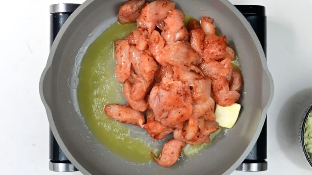 cooking chicken strips in a pan