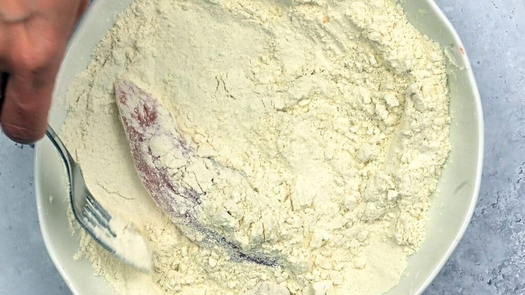 coating chicken in flour