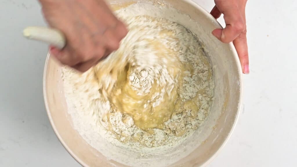 Stirring batter for cinnamon bread in a bowl