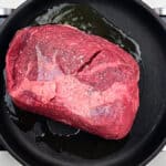 Searing beef joint in a skillet