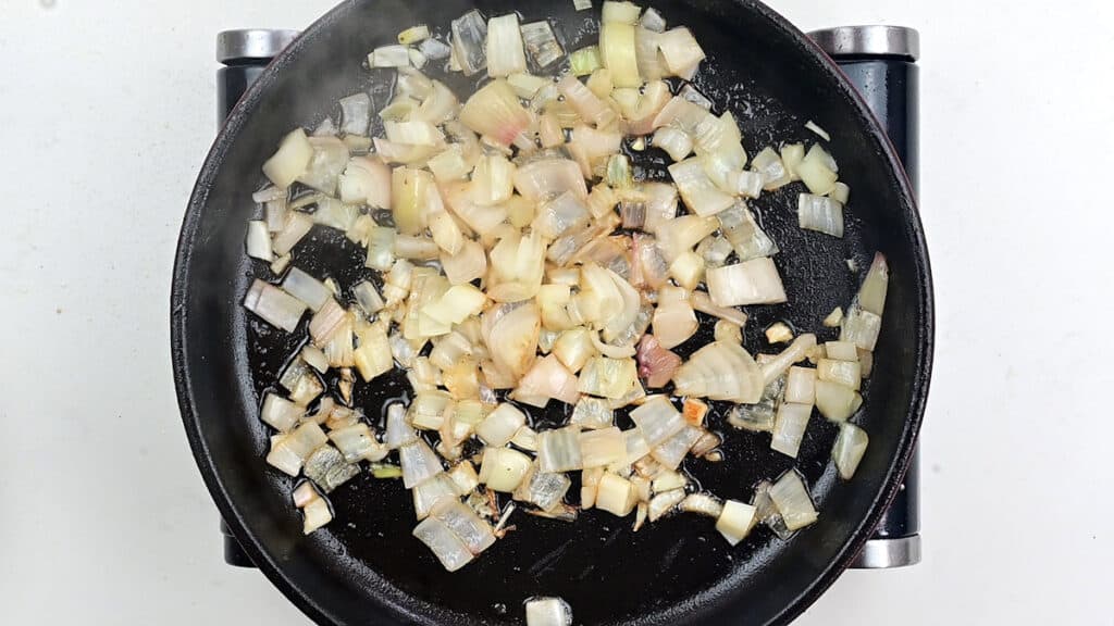 cooking shallots in a pan