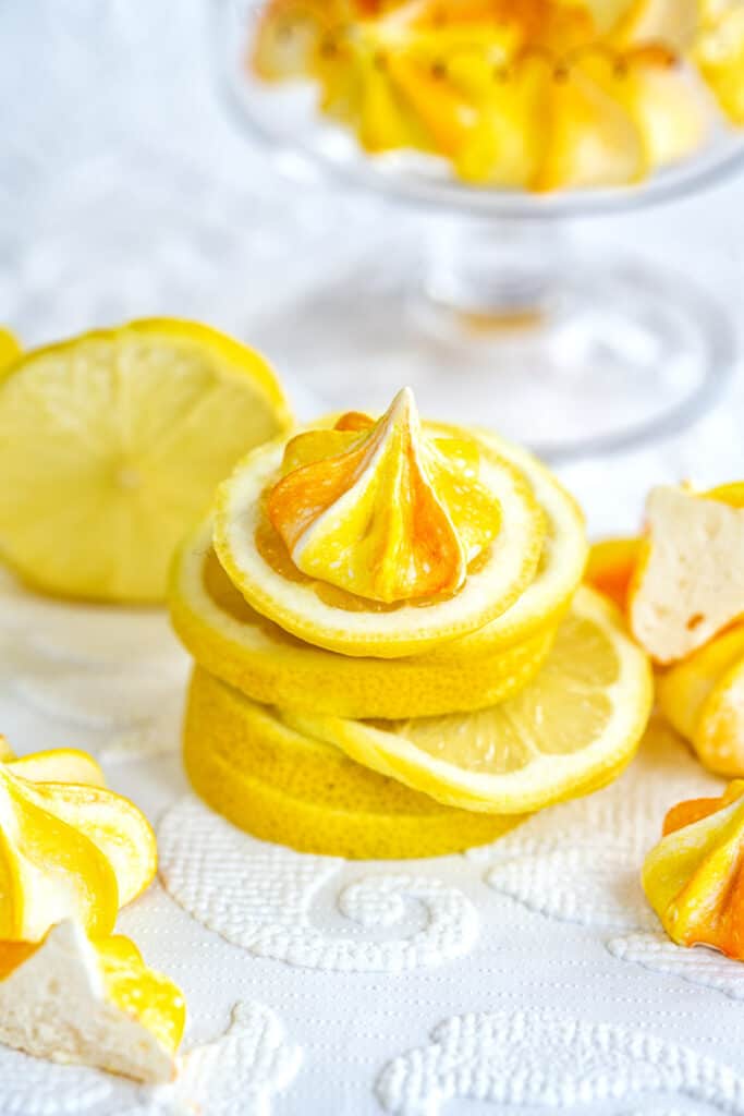 lemon meringue cookies on slices of lemon