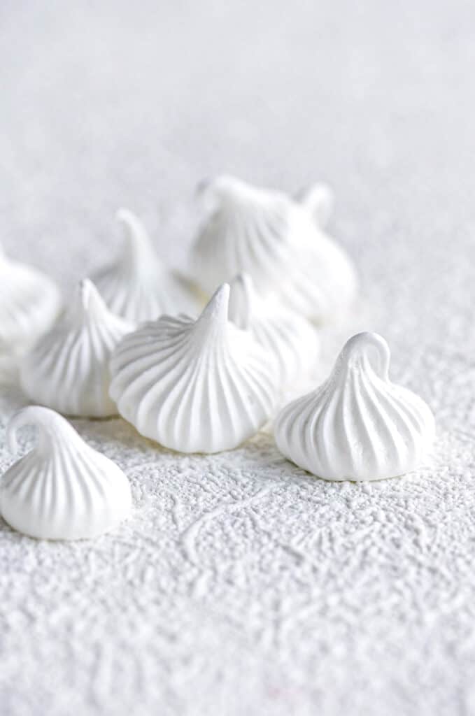close up on meringue cookies on a white background