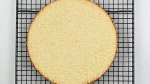 sliced sponge cake on a cooling rack