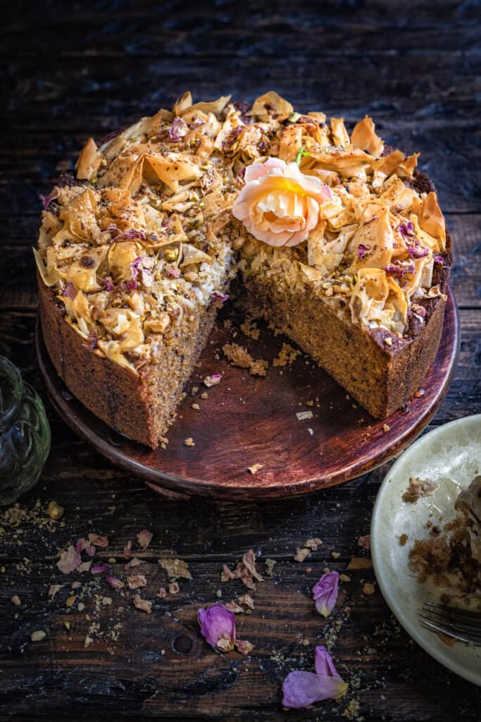 Cake topped with pastry and chopped nuts