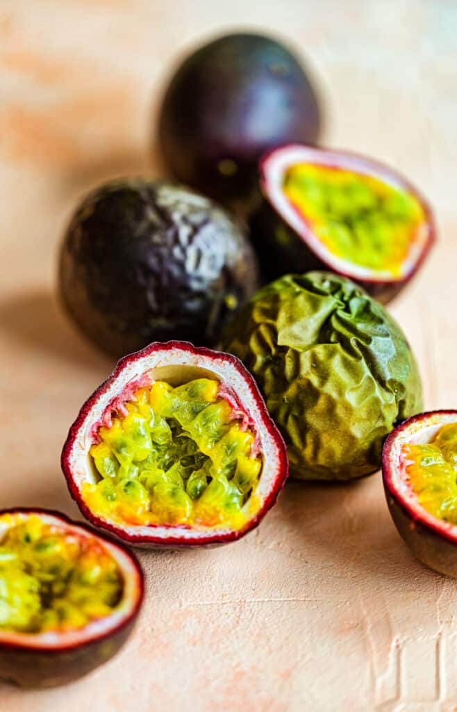 sliced and whole fresh passion fruit