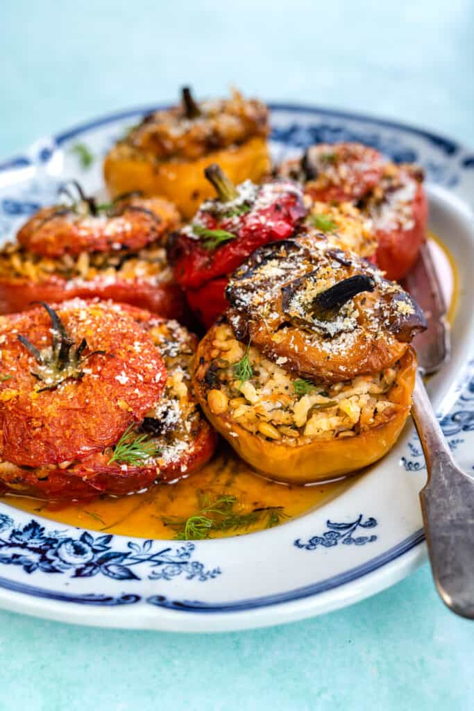 Stuffed tomatoes and peppers on a platter (Greek gemista)