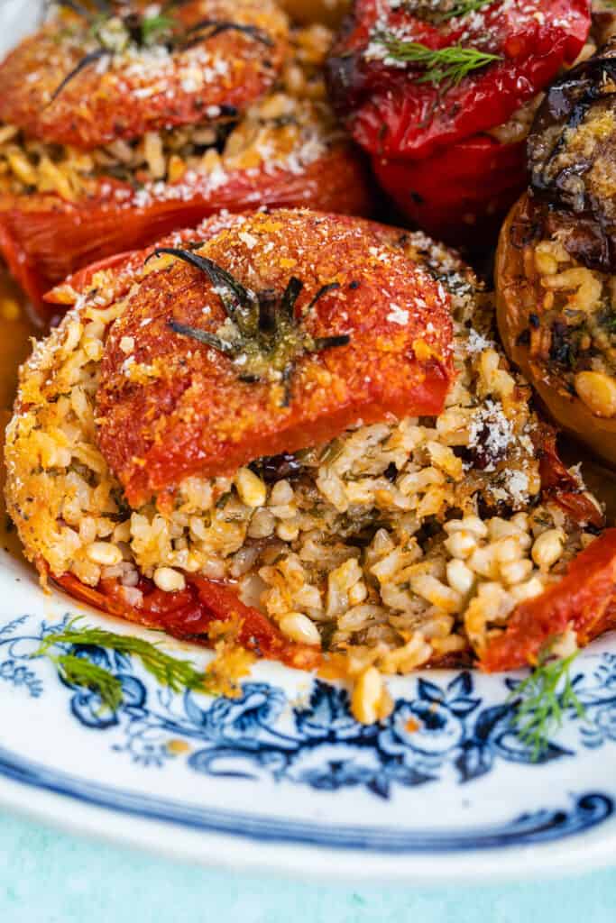 close up on a baked tomato stuffed with rice and herbs