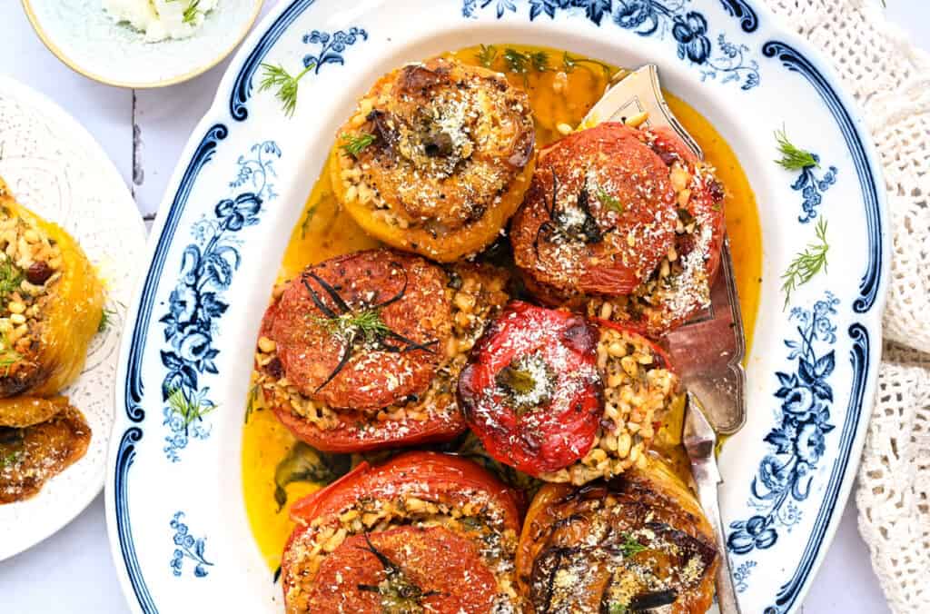 Rice stuffed tomatoes and peppers on a plate