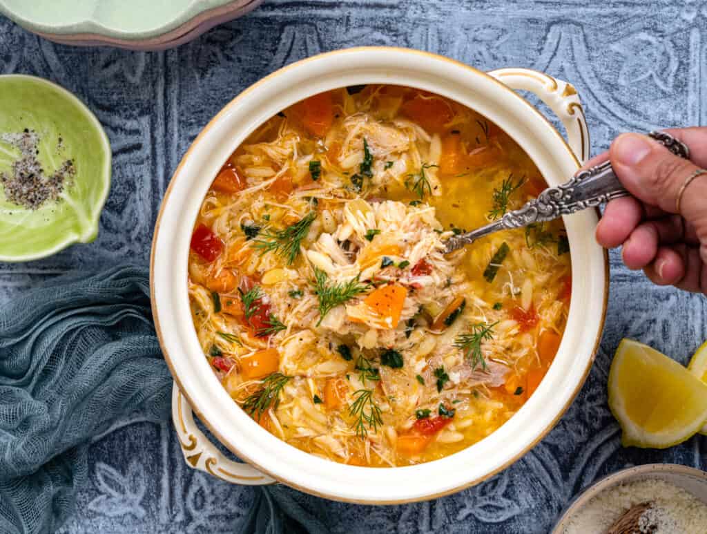 Slow cooker whole chicken soup with orzo and herbs