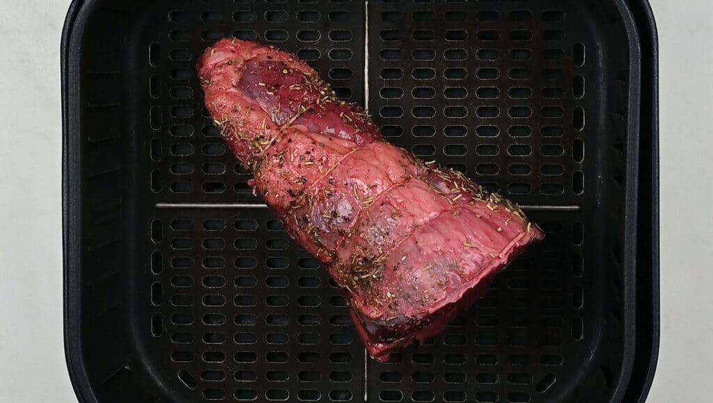beef joint in an air fryer basket