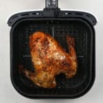 Cooked turkey in an air fryer basket