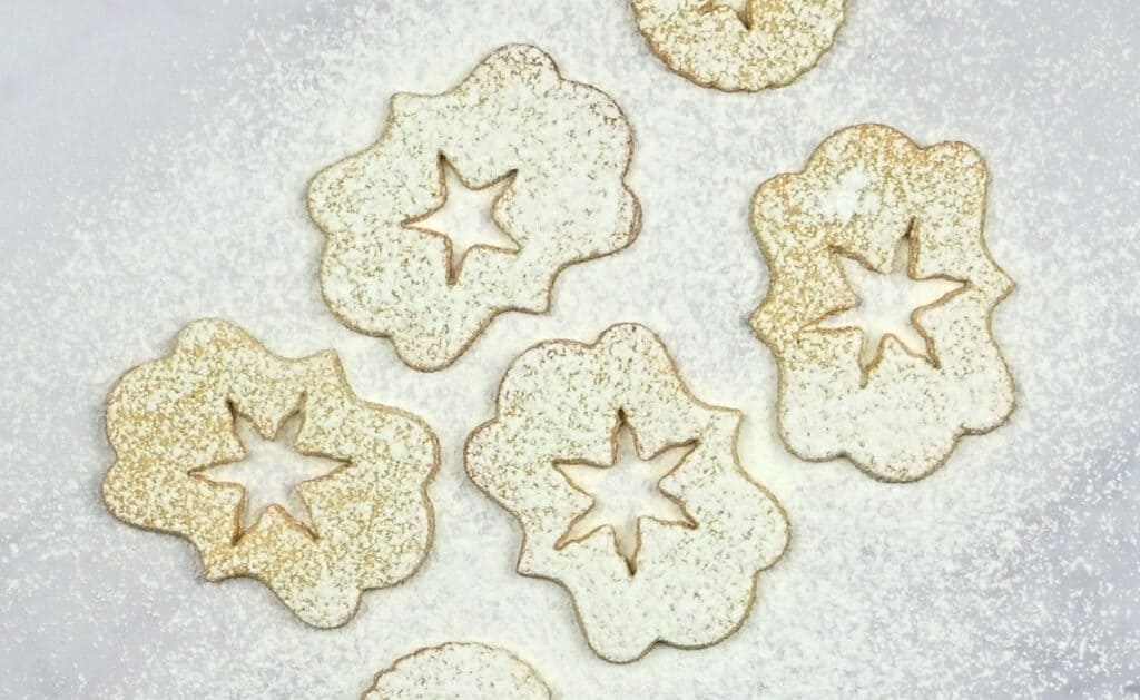 Linzer cookies dusted with powdered sugar