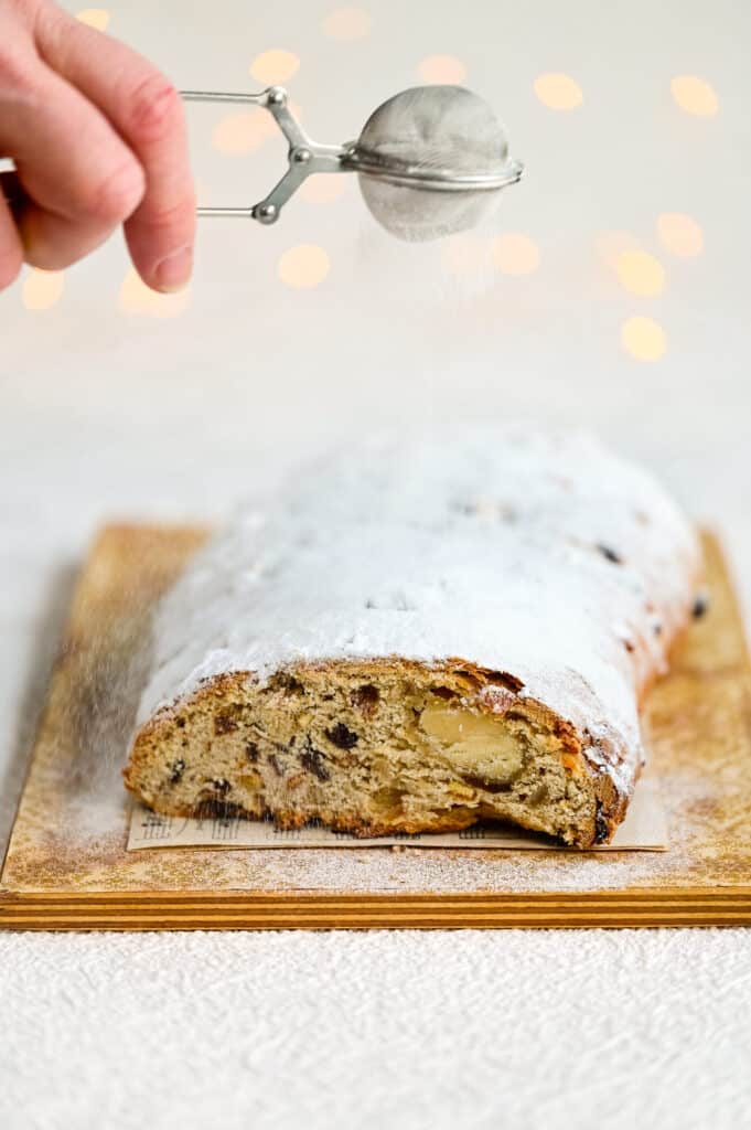 Dusting Stollen loaf with sugar