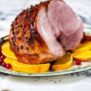 Air Fryer Gammon with redcurrant glaze on a plater with slice cut