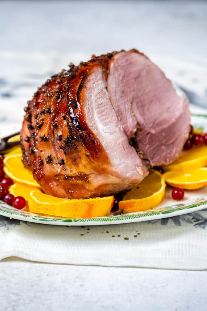 Air Fryer Gammon with redcurrant glaze on a plater with slice cut