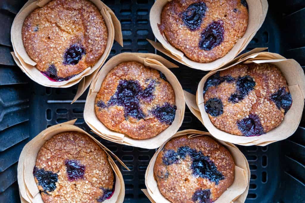 Blueberry muffins in an air fryer basket