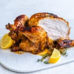 Air fryer whole chicken rotisserie style with slice cut