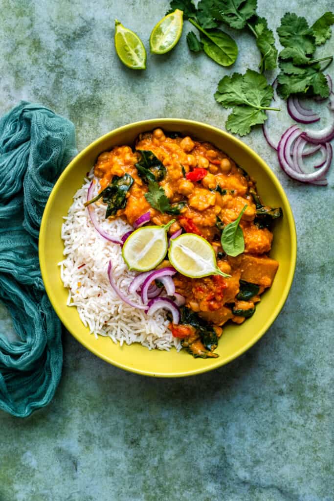 Slow Cooker butternut squash curry served with rice in a bowl