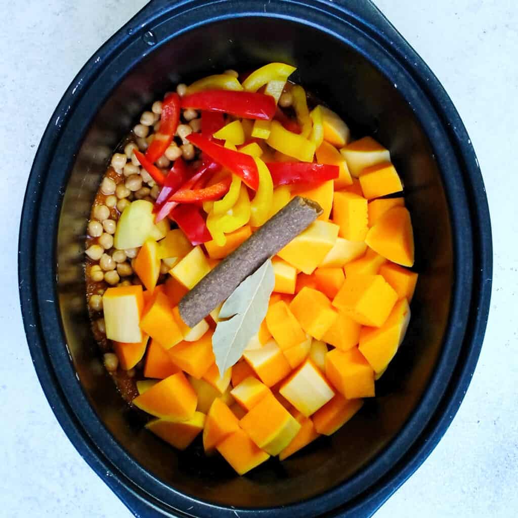 Ingredients for vegan butternut squash and chickpea curry in a slow cooker