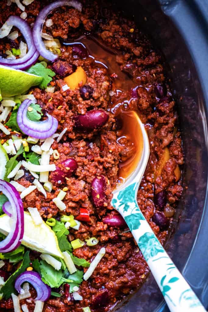 close up on a slow cooker with chilli con carne