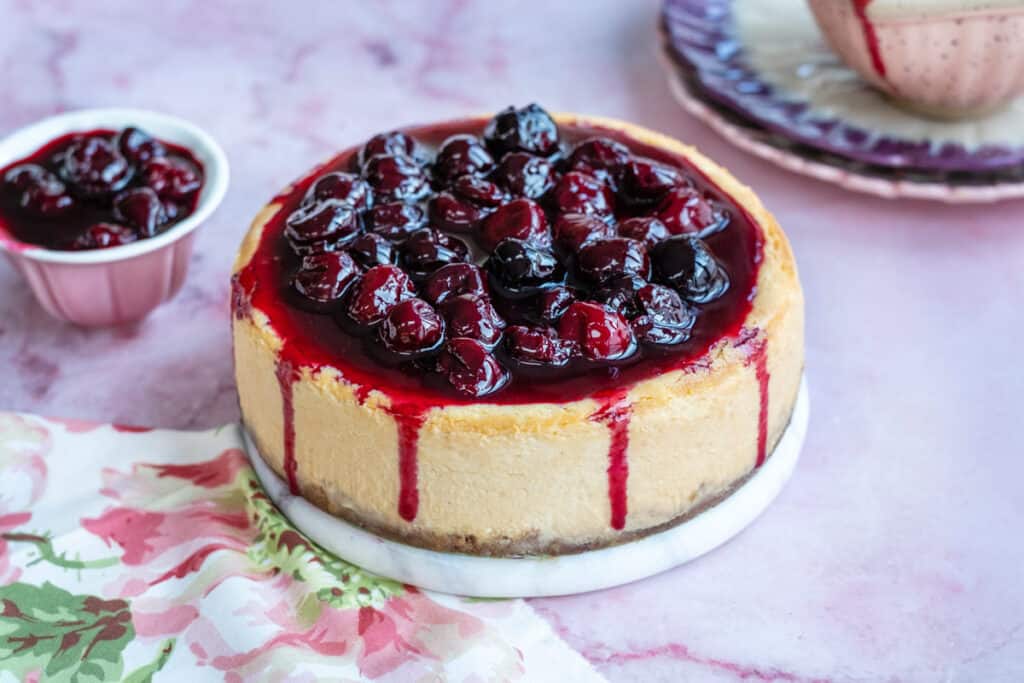 Air Fryer Cheesecake New York style topping with cherry pie filling