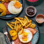 Air fryer gammon stekas (ham steaks) served with chips, egg and chips