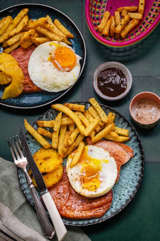 Air fryer gammon stekas (ham steaks) served with chips, egg and chips
