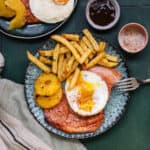 Plate with air fryer gammon steak, pineapple rings, egg and chips