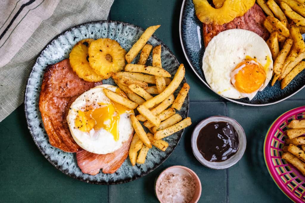 Air fryer gammon steaks with egg and chips, overhead view
