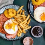 Air fryer gammon steaks with egg and chips, overhead view