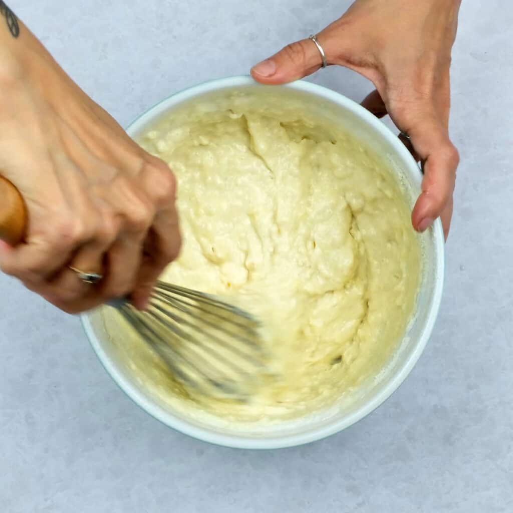 mixing buttermilk pancake batter in a bowl