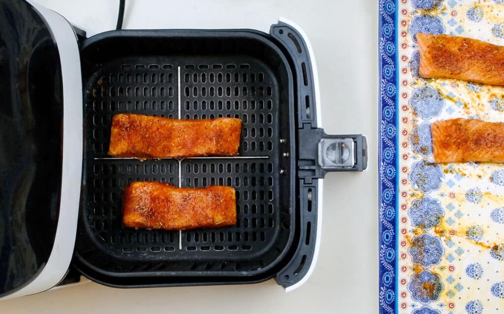 Salmon fillets in the basket of an air fryer