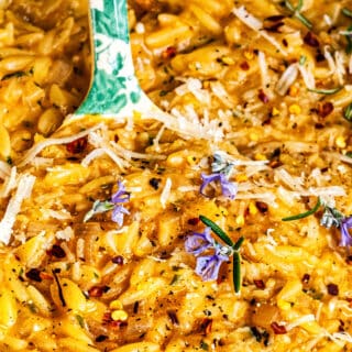 Creamy Orzo With Rosemary Browned Butter close up with large spoon