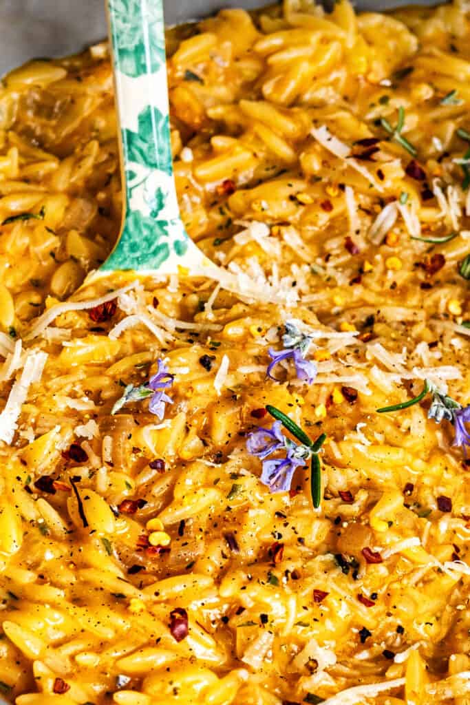 Creamy Orzo With Rosemary Browned Butter close up with large spoon 