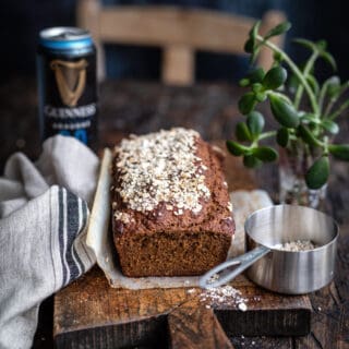 Loaf of Irish Guinness bread on a rustic wooden board